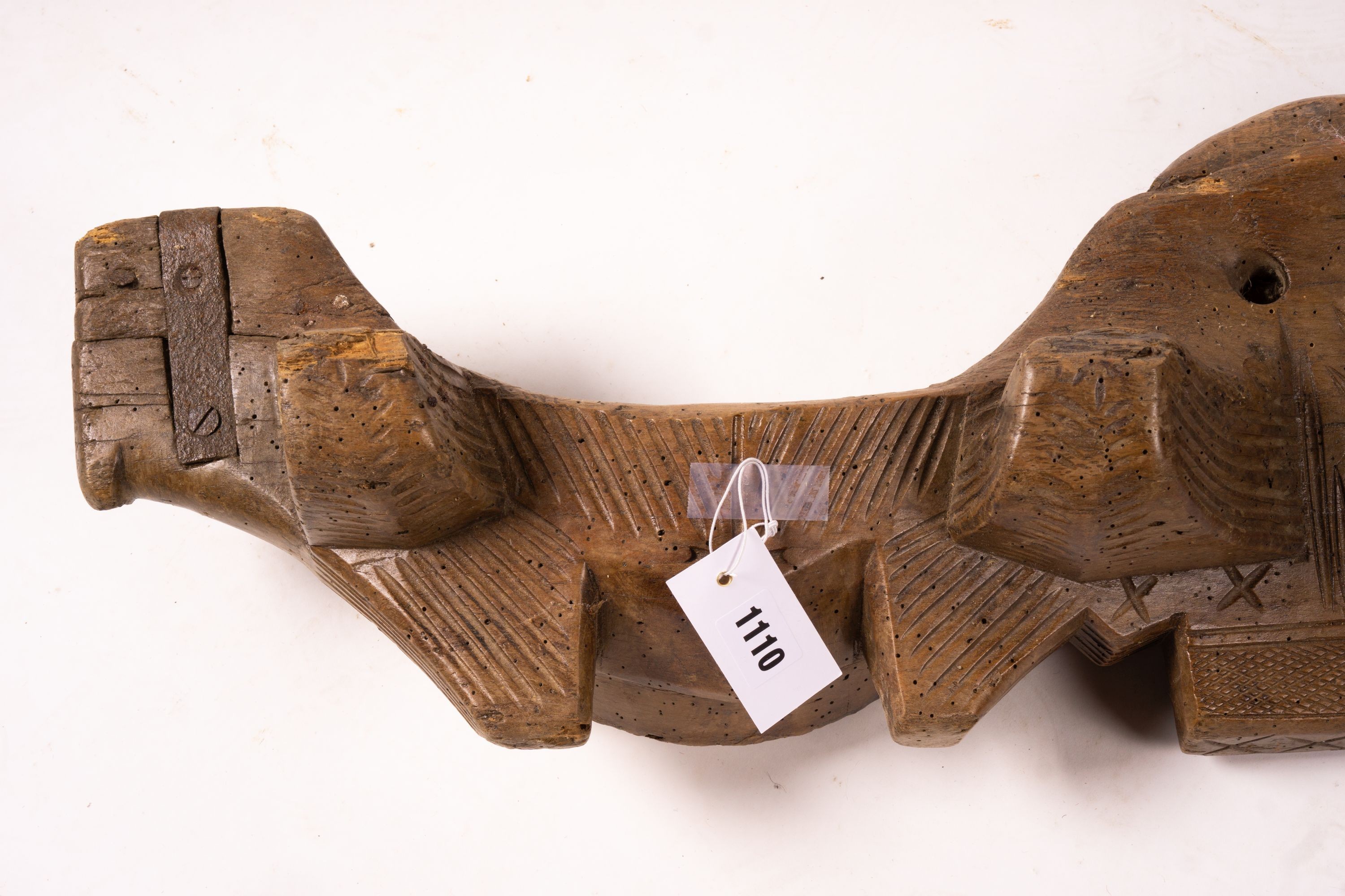 A 19th century Spanish carved fruitwood ox yoke, length 108cm